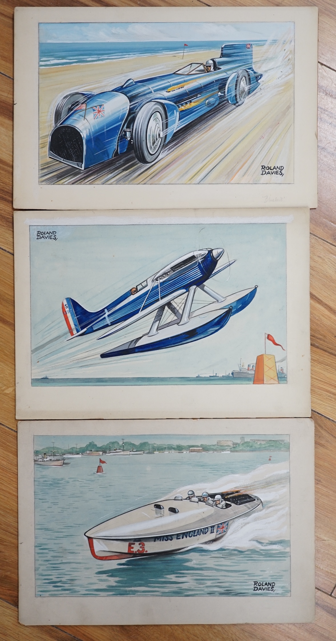 Roland Davies (1904-1993), three original watercolours for postcard designs, speed record holders, ‘Schneider Trophy Plane’, ‘Miss England Speedboat’ & ‘Bluebird’, each signed, unframed, 20 x 31cm. Condition - fair to go